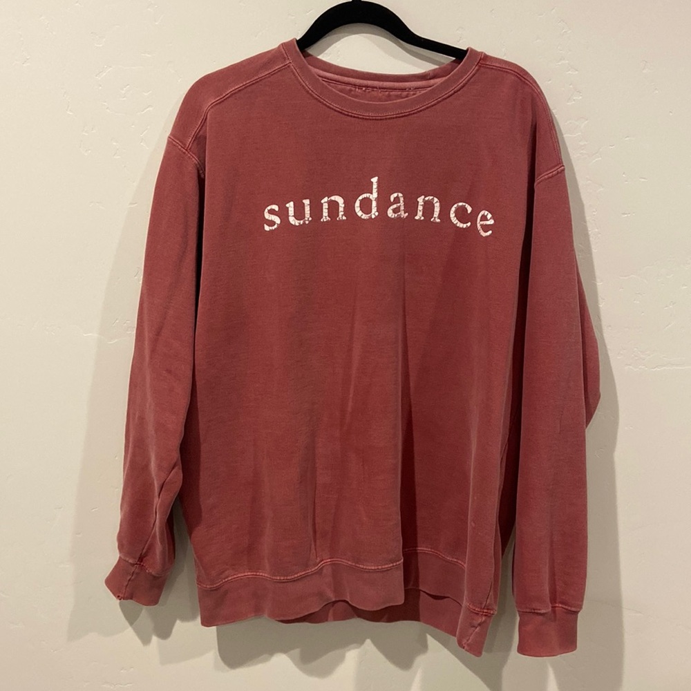 Sundance crew sweatshirt in red. Lightly used. Faded mark on one sleeve.